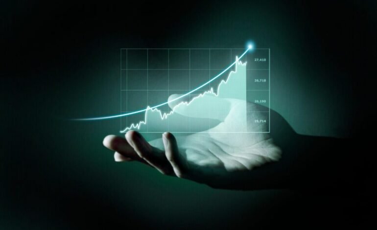 Hand holding rising stock chart symbolizing financial growth