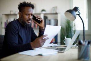 Man stressed with bills